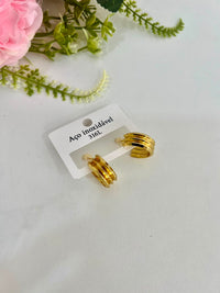 brinco dourado aço
